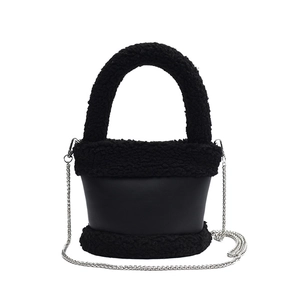 Faux fur and black leather bucket bag with silver chain strap and plush handle