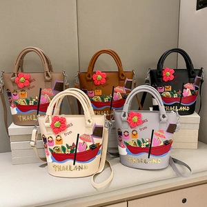 Retro PU leather bucket bags with Thailand style embroidery and floral charms in five colors
