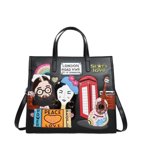Vintage black leather tote with London street embroidery and Beatles-inspired patches