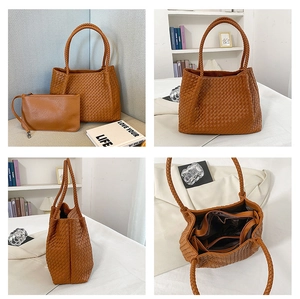 Detailed view of the woven texture on a brown tote bag with its inner zipper pouch