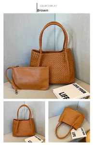 Detailed view of brown woven tote bag set with matching zipper clutch and top handle