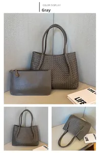 Macro view of grey woven tote bag set with matching zippered inner pouch detail