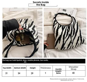 Tabella taglie dettagliata per borsa in maglia zebrata: larghezza 34cm e altezza 29cm