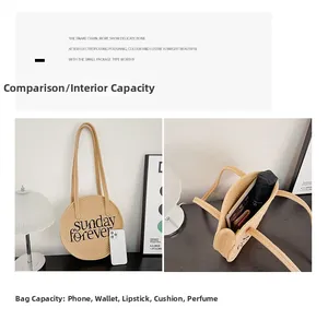 Detail view showing spacious interior of straw shoulder bag with phone and essentials