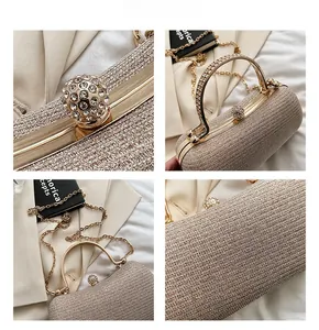 Detail of evening clutch with sparkling champagne texture and crystal ball clasp lock