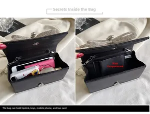 Detail view of black rhinestone clutch bag showing interior storage capacity and bow detail