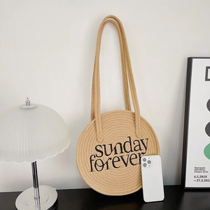 Straw circular shoulder bag with Sunday Forever embroidery and long straps for beach travel