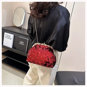 Detailed back view of a red sequin evening clutch bag with elegant gold chain strap