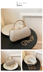 Detailed views of a silver sequin evening clutch with rhinestone handle and gold chain