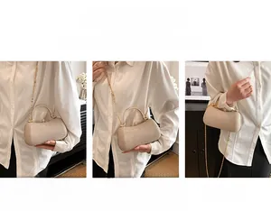 Detailed view of the champagne gold sequin clutch bag used as a shoulder and crossbody bag