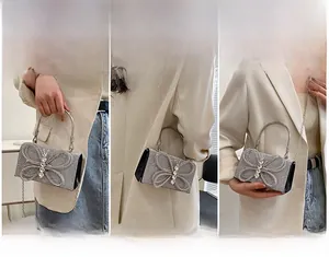 Three-way carry view of silver rhinestone evening bag with 3D butterfly design
