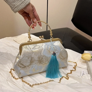 Floral jacquard kiss-lock clutch bag with golden handle and blue silk tassel charm
