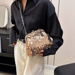 Elegant gold sequin evening clutch bag with chain strap, featuring crystal clasp closure