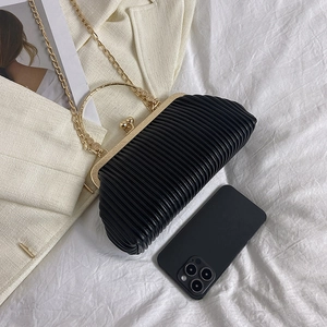 Chic black pleated evening clutch bag with gold chain strap and circular metal handle