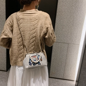 Ethnic silver elephant evening bag with sparkling rhinestones and pearl handle
