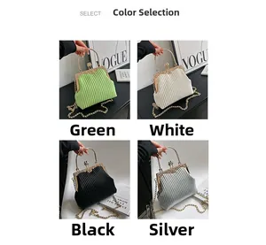 Detail view of vintage pleated evening clutches in green, white, black, and silver colors