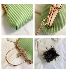 Detailed views of mint green pleated clutch with vintage floral gold frame and metal handle