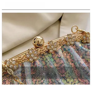 Detail showing crystal flower accents and iridescent sequins on a luxury evening clutch