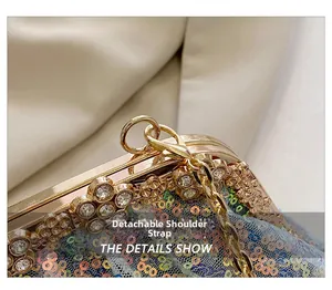 Detail of the detachable gold chain strap and sequin evening clutch with rhinestones