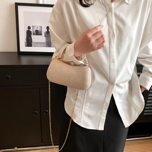 Elegant champagne gold sequin evening bag with a luxury crystal clasp and chain strap