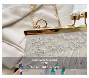 Detail of white sequin evening clutch with pearl clasp and detachable gold chain strap