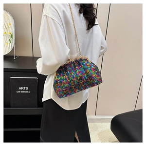 Detail of colorful sequins texture and gold metal clasp on evening crossbody bag