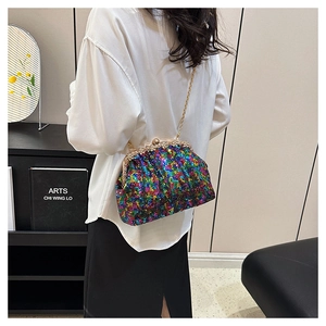 Detailed view of rainbow sequined evening clutch with diamond-encrusted metal clasp