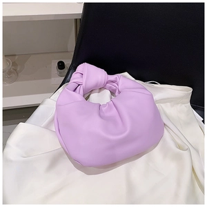 Detailed view of the lavender purple cloud bag featuring a knotted handle and pleated design