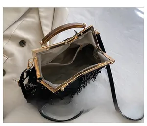 Detailed interior of sequin tassel clutch with herringbone lining and inner pocket