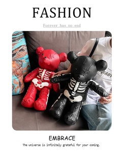 Detail of gothic punk teddy bear backpacks in red and black with skeleton bone print