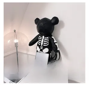 Detail shot of black gothic bear backpack showing skull bone pattern and premium PU leather