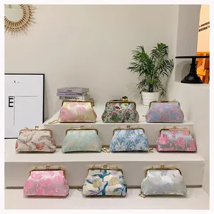 Collection of vintage jacquard evening bags with floral embroidery and gold clasps