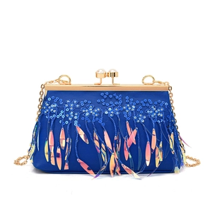Blue sequin evening clutch bag with fringe tassels and gold chain shoulder strap