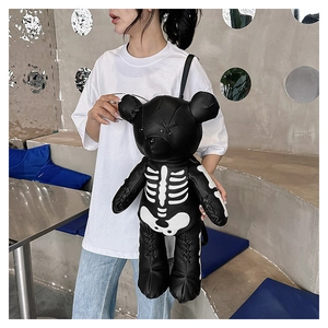 Detail of creative black gothic bear backpack with white skeleton bone prints for women