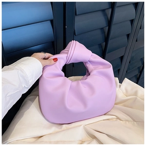 Detail of lilac knotted hobo bag showing the elegant handle knot and matte finish