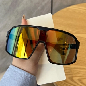Detail view of large rimless polarized lens with vibrant orange-yellow gradient finish
