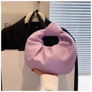 Detail of lavender knotted cloud bag showing smooth faux leather and soft pleated texture