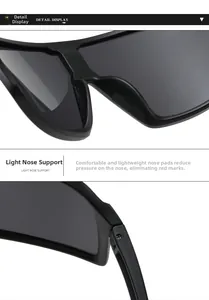 Macro detail of lightweight nose pads and sturdy hinges on black oversized sunglasses