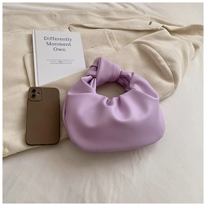 Detail of lilac knotted handle and pleated texture on the soft cloud dumpling handbag