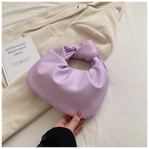 Detail of lavender purple pleated cloud bag with stylish knot handle and soft PU texture