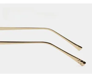 Detailed close-up of golden curved metal temples with non-slip tips for stylish sunglasses