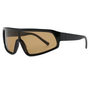 Oversized wrap-around sunglasses with glossy black frame and amber gradient lenses