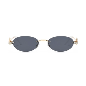 Fashionable rimless oval diamond sunglasses with golden metal planet logo temples