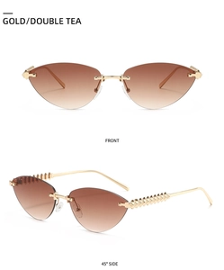 Détails de lunettes œil de chat sans monture dorées avec verres dégradés et pointes