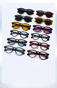 Matrix display of 12 vintage round sunglasses and blue light glasses in various color styles