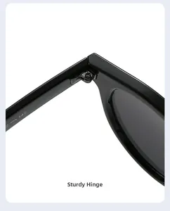 Detail of sturdy metal hinge on polished black round sunglasses with size 147 marking