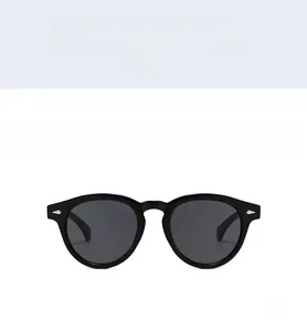Front view of black retro round sunglasses with silver studs and dark gray lenses