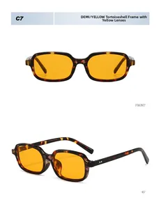 Close-up of retro square sunglasses featuring tortoise frames and yellow tinted lenses
