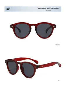 Detailed front and 45-degree view of red translucent round sunglasses with silver rivets