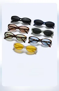 Flat lay display of retro oval cat eye sunglasses in seven trendy color combinations